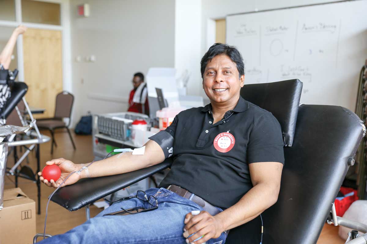 Editorial illustration: a blood donor giving blood at a community blood drive
